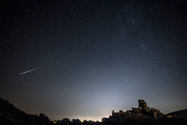 Corey Castle, United Kingdom - 12 August 12: A percussion meteor shone in the night sky above Corey Castle on 12 August 2016 at Corey Castle in the United Kingdom.  The Perseids meteor shower occurs every year as the Earth passes through a cloud of debris left by the comet Swift-Tuttle, and is seen revolving from the constellation Perseus in the eastern sky.  (Photo by Dan Keatwood / Getty Images)