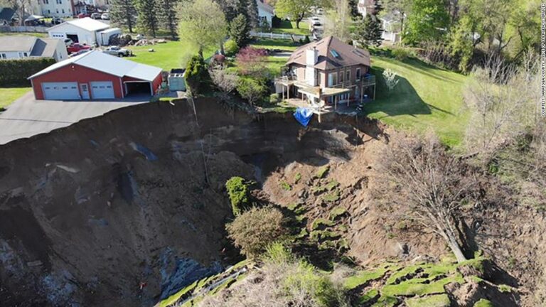 A landslide in New York state leaves houses dangling a few centimeters from a giant crater