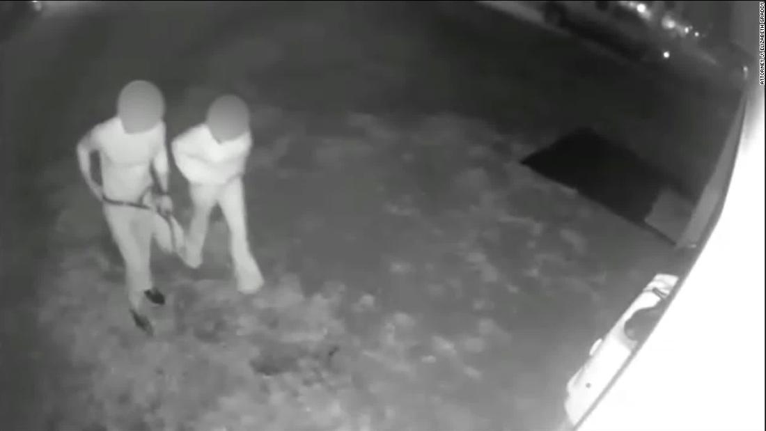 Night video shows a male and a female enter the home from outside.