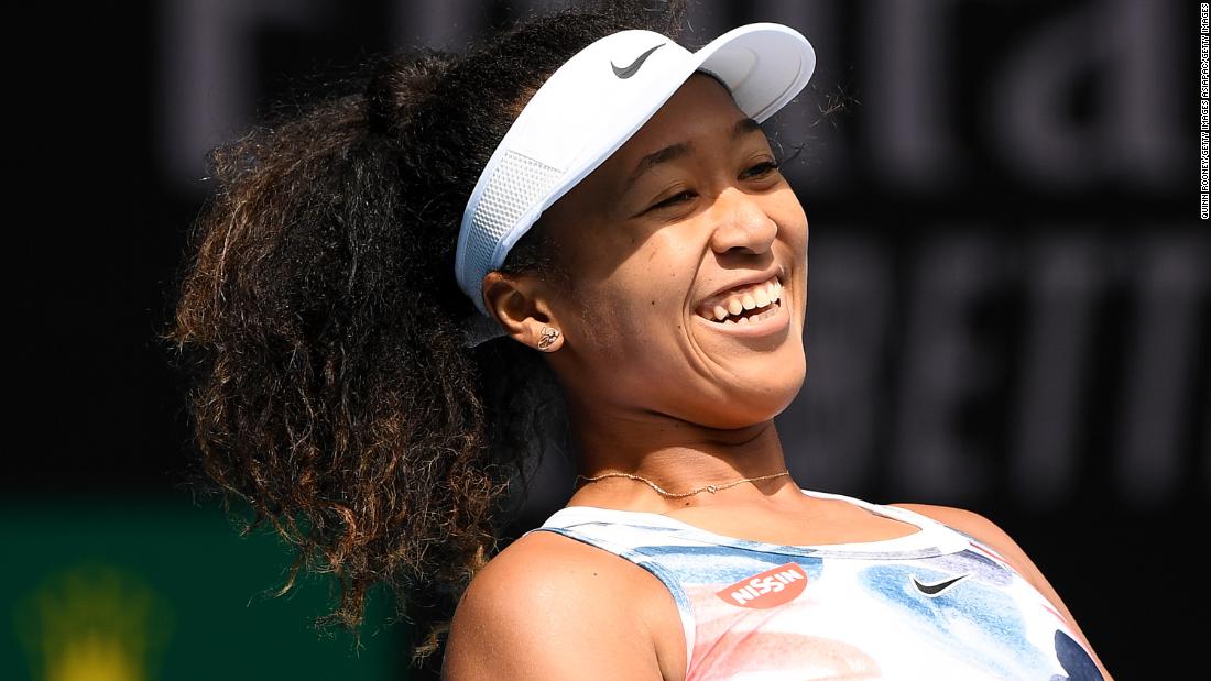 Naomi Osaka of Japan poses with the trophy after beating Australia's Ashleigh Barty in the final of the China Open in Beijing.