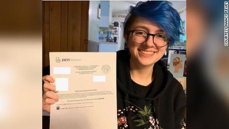 Willa Pevey, 17, holds an approval receipt for her new driver's license which she applied online without doing a road test. 