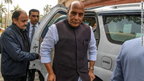 Indian Defense Minister Rajnath Singh (C) arrives in Parliament in New Delhi on 11 February.
