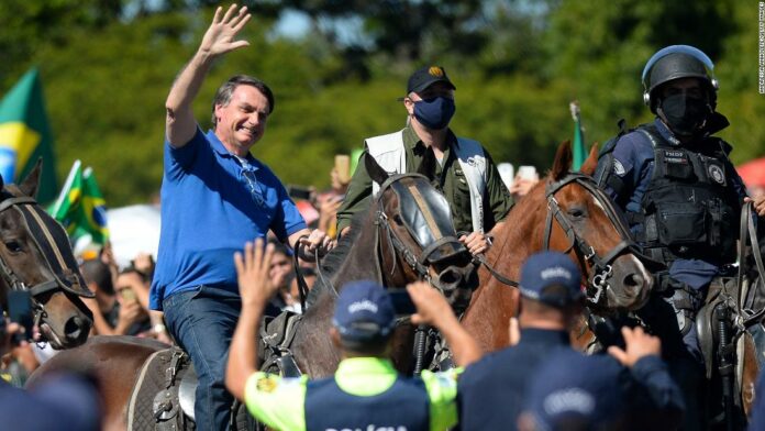 Brazilian President Jair Bolsonaro rides a horse during a pro-government demonstration on May 31 in Brasilia.