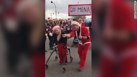 Cerebral palsy could not stop this seventeen year old from finishing Santa's run using a walker