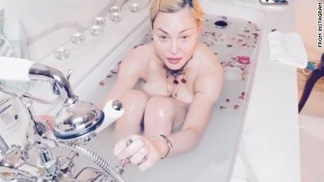 Coronavirus is &#39;the great equalizer,&#39; Madonna tells fans from her bathtub