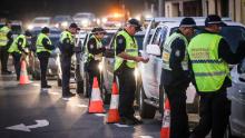 Police stop and question drivers at a checkpoint on July 8 in Albury, Australia. 