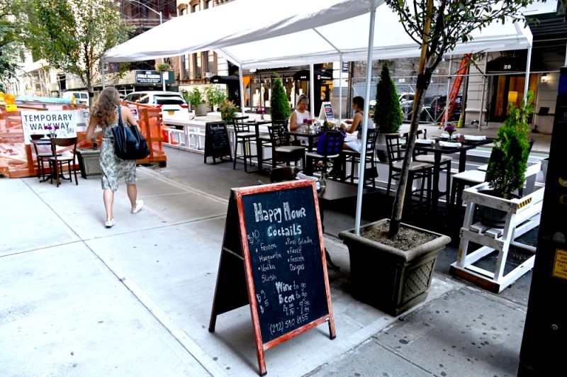 NEW YORK - JULY 27: An outdoor dining area is seen as the city continues Phase 4 of re-opening following restrictions imposed to slow the spread of coronavirus on July 27, 2020 in New York City. Many restaurants have built outdoor seating on the streets in order to allow for social distancing between patrons. The fourth phase allows outdoor arts and entertainment, sporting events without fans and media production. (Photo by Jamie McCarthy/Getty Images)