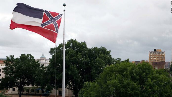 Mississippi governor signs bill to retire flag with Confederate emblem