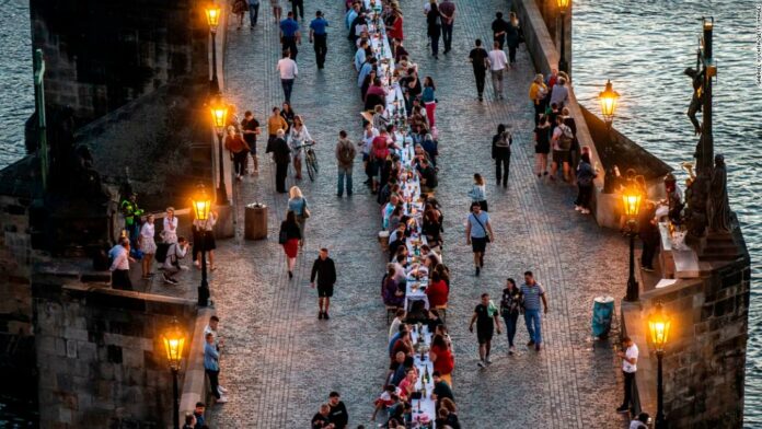 Prague celebrates end of coronavirus lockdown with mass dinner party at 1,600-foot table