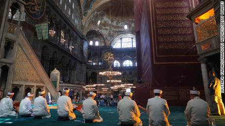 Worshipers join a prayer program at Hagia Sophia ahead of the first Friday prayers there in 86 years.