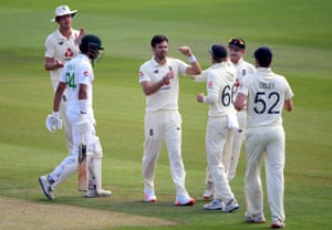 England’s James Anderson celebrates taking the wicket of Pakistan’s Shan Masood (left).