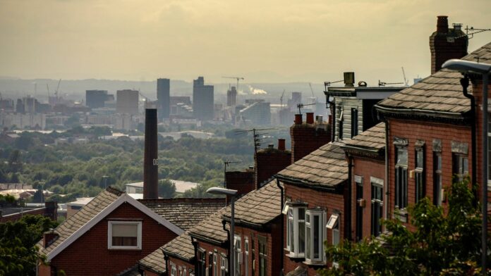 OLDHAM, ENGLAND - JULY 29: A general view of an old cotton mill in Oldham with the city of Manchester on the horizon on July 29, 2020 in Oldham, England. Oldham Council is taking preventative measures to prevent a local lockdown during the coronavirus pandemic. The Greater Manchester town has become England's second highest Covid-19 infection rate, after Blackburn with Darwen, and is currently showing a Covid-19 infection rate of 54.3 cases per 100,000 people.  (Photo by Christopher Furlong/Getty Images)