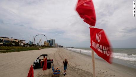 No swimming flags fly over a lifeguard stand in downtown Myrtle Beach, South Carolina on Monday, August 3, 2020.