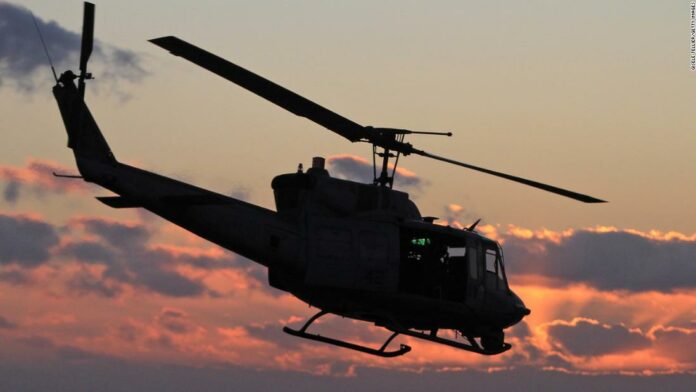 Military helicopter shot at over Virginia, injuring a crew member