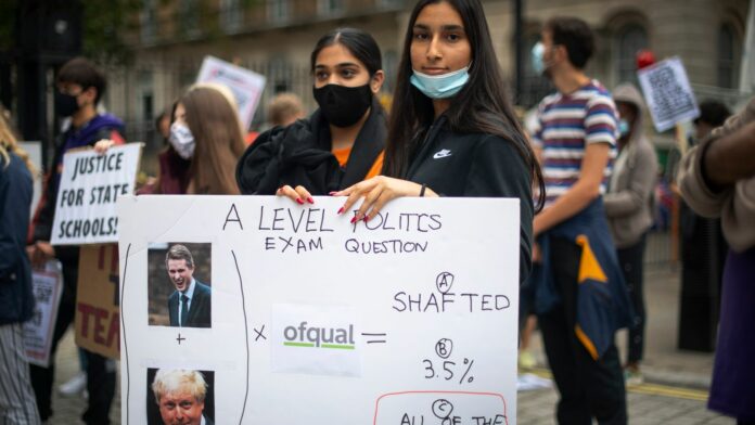 Students take part in a protest in Westminster in London over the government&#39;s handling of A-level results