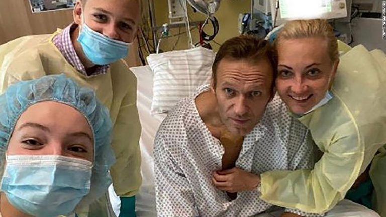 Alexei Navalny: Opposition leader posts photo of hospital after poisoning as aide says he plans to return to Russia