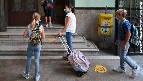 Masked students arrive for the start of the school year on September 14 at Luigi Einoudi Technical High School in Rome, Italy.