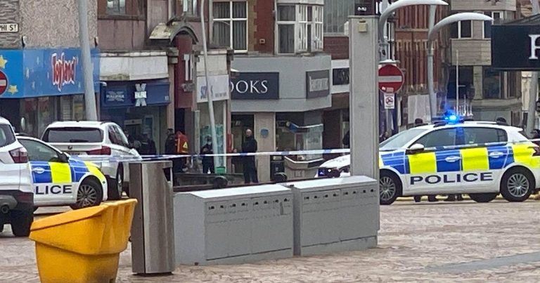 Live: Armed police live outside the Halifax Bank in Blackpool with a man on a mobility scooter who put petrol inside.