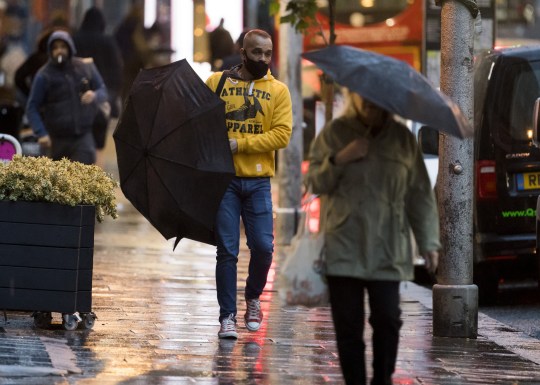 ?  Licensed for London News Pictures.  02/10/2020.  London, UK.  Members of the public battle through heavy rain and wind during a morning trip at Ladbroke Grove in West London, as Storm Alex brings 90 MPF wind and heavy rain over much of the UK.  Photo credit: Ben Couthra / LNP