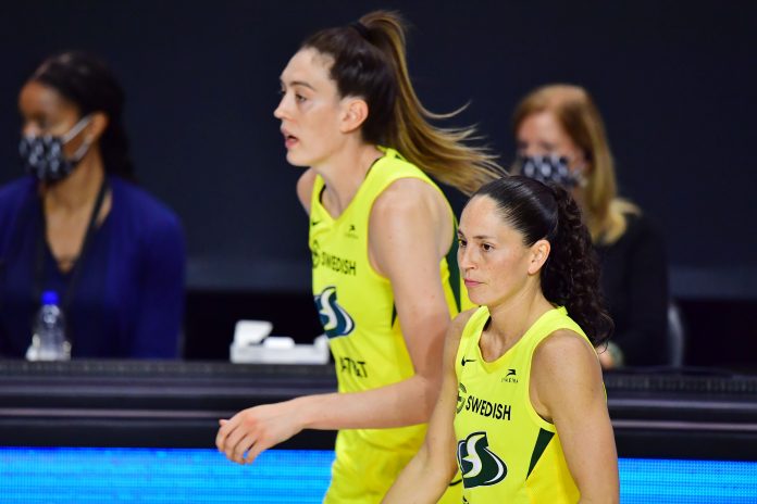 PALMETTO, FLORIDA - OCTOBER 04: Breanna Stewart #30 and Sue Bird #10 of the Seattle Storm run back out to the court after a timeout in the second half of Game 2 of the WNBA Finals against the Las Vegas Aces at Feld Entertainment Center on October 02, 2020 in Palmetto, Florida. NOTE TO USER: User expressly acknowledges and agrees that, by downloading and or using this photograph, User is consenting to the terms and conditions of the Getty Images License Agreement. (Photo by Julio Aguilar/Getty Images)