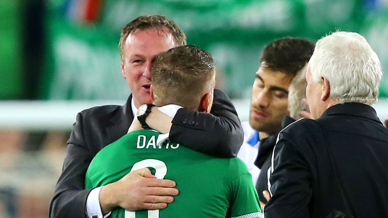 Northern Ireland boss Michael O'Neill congratulates Steven Davis after the final whistle of the UEFA European Championship qualifying match at Windsor Park.