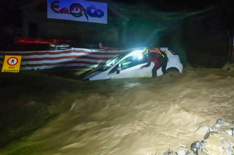 The city of Limon Pemonte in Italy was flooded by a firefighter next to a car that was partially submerged after heavy rain.  Storms in France and Italy have killed at least two people and left at least 25 missing.