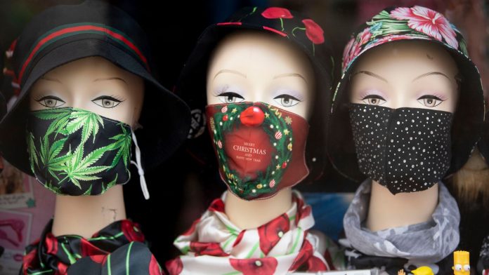 BRIDGEND, WALES - OCTOBER 28: A close-up of mannequins wearing face masks in shop window on October 28, 2020 in Bridgend, Wales. Wales entered a national lockdown on Friday evening which will remain in place until November 9. People have been told to stay at home and pubs, restaurants, hotels and non-essential shops must shut. Primary schools will reopen after the half-term break, but only Years 7 and 8 in secondary schools can return at that time under new "firebreak" rules. Gatherings indoors 