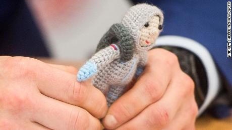 Expedition 64 crew member Sergei Kud-Sverkov has a knitted cosmonaut named Yuri created by his wife Olga.