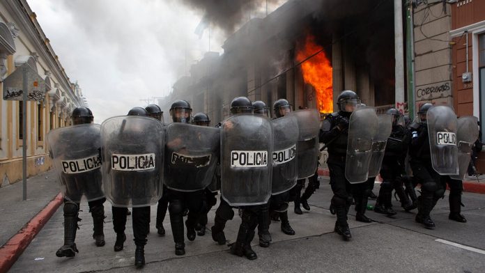 In Guatemala, protesters stormed a congressional building, setting it on fire

