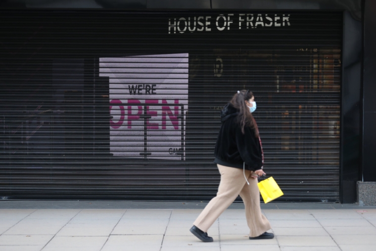 An open sign behind a closed shutter at House Fra Fraser on Innsford Street in London on the third day of a four-week national lockdown for England to combat the spread of Covid-19.  P.A.  Photo.  Picture date: Saturday, November 7, 2020. See PA story Health Coronavirus.  Photo credit should read: UE Mock / PA Wire