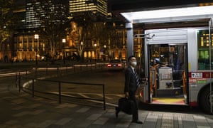 A man wearing a face mask gets on a bus near Tokyo station on Thursday, November 12, 2020 to prevent the spread of coronavirus.