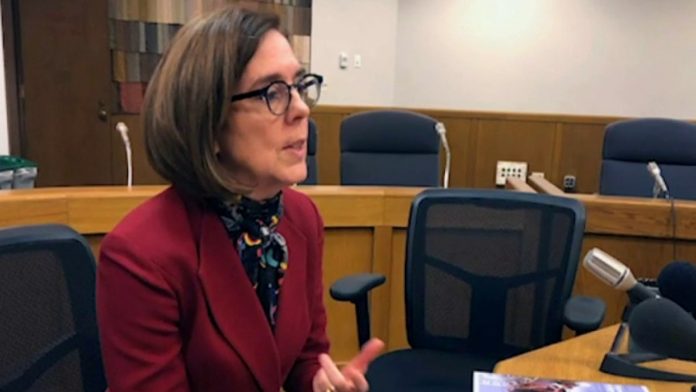 Oregon governor calls on residents to call cops on people violating COVID restrictions

