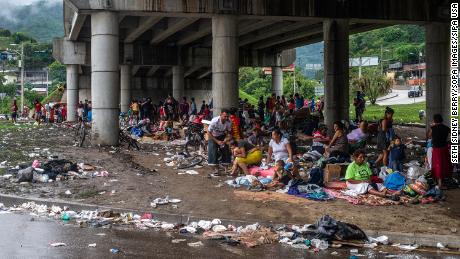 Floods after Hurricane Ata forced people to flee their homes in the San Pedro Sula Valley, sheltering in a makeshift camp under an overpass in Chimelacan, Honduras.