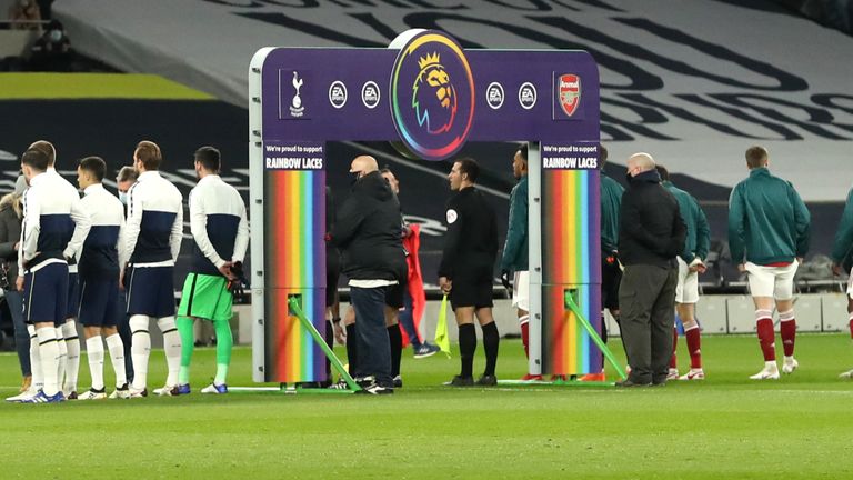 LONDON, England - December 06: Ahead of the Premier League match between Tottenham Hotspur and Arsenal at Tottenham Hotspur Stadium, both players line up in front of a handshake board with Stonewall Rainbow Lace branding in support of their campaign.  December 06, 2020 in London, England. 