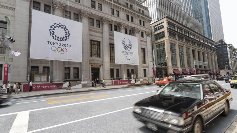 July 25, 2019, Tokyo, Japan - Giant banners of the Tokyo 2020 Olympic Games are displayed outside the Sumitomo Mitsui Trust Bank to promote the 2020 Tokyo Olympic and Paralympic Games.  Tokyo marks a year leading up to the 2020 Olympics with Olympic emblems and photographs of Japanese athletes in some buildings in the Nihonbashi district in Tokyo.  The Games are scheduled to open on July 24, 2020.  PublicationsxINxGERxSUIxAUTxHUNxONLY (108582889)  
