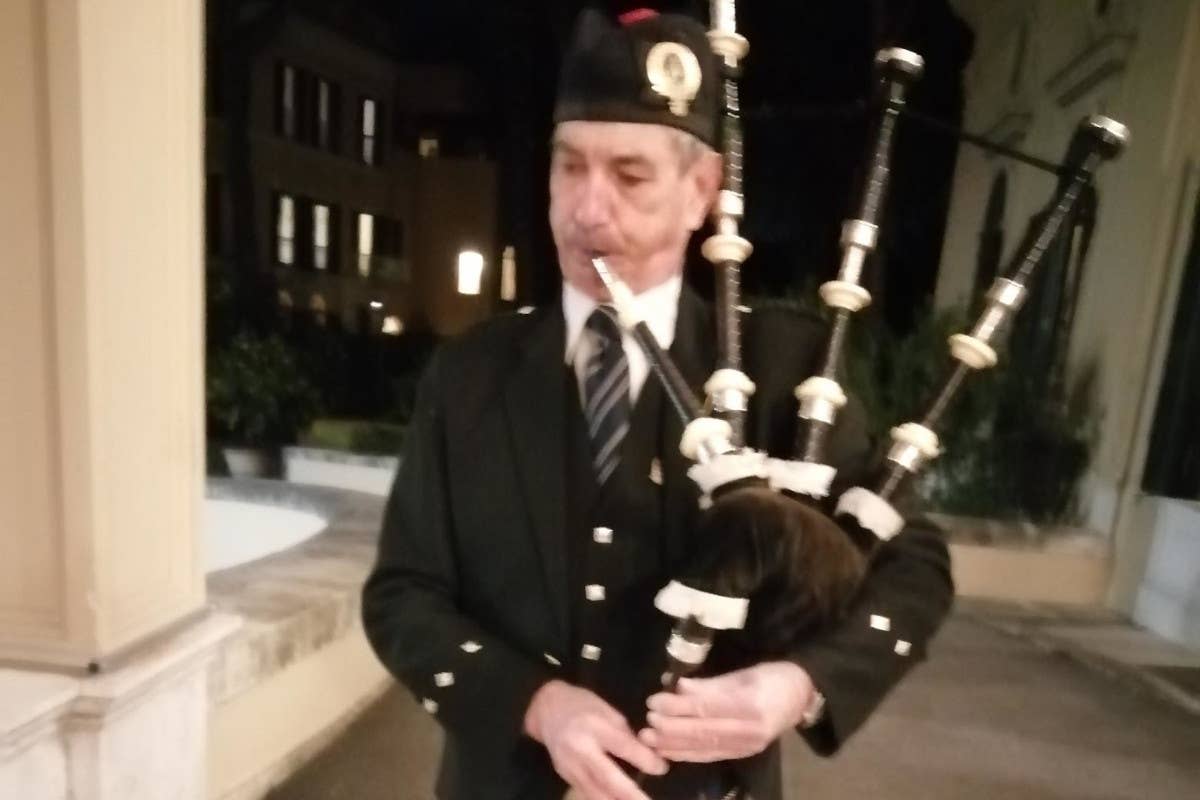 A bagpipe player starry dinner in memory of the poet Robert Burns
