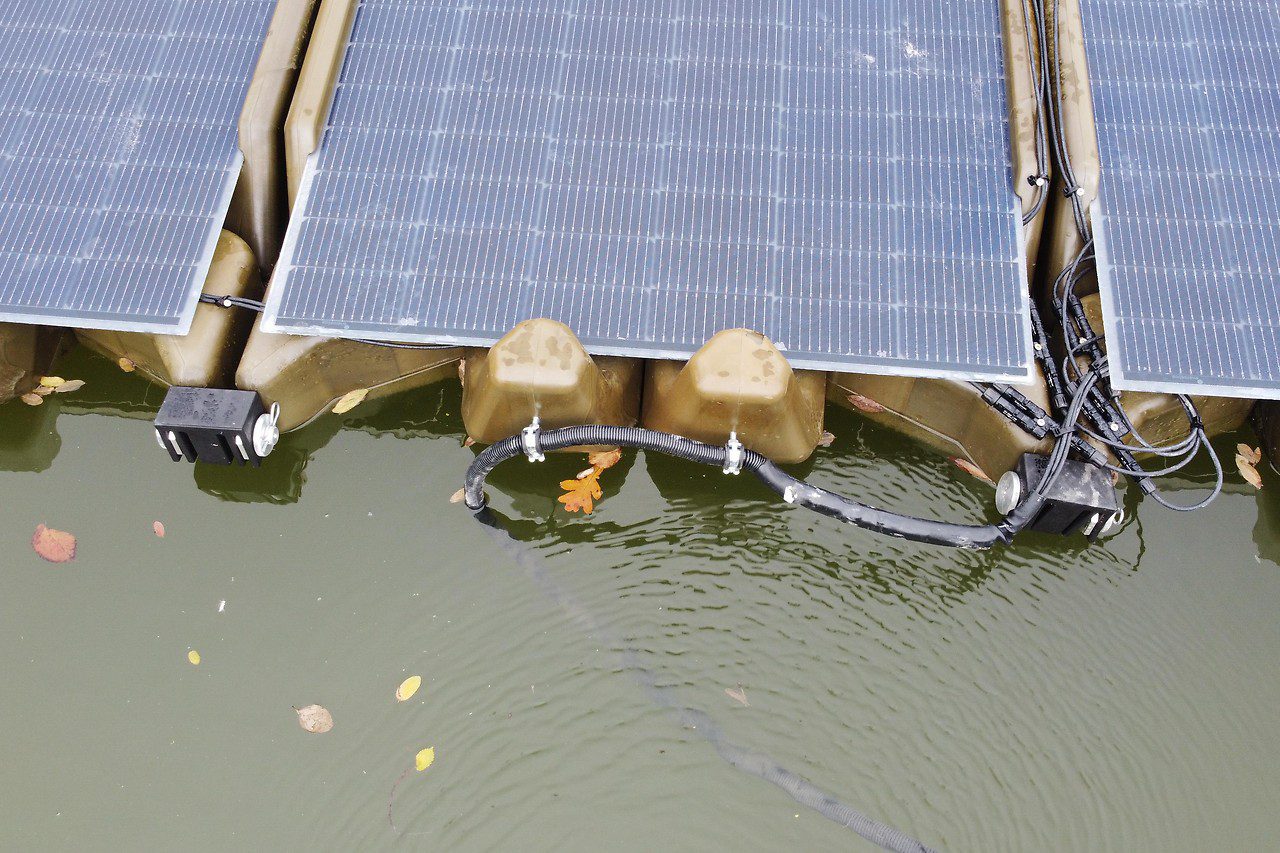 One PV system from Soloan on a gravel pond, eight PV modules on the water