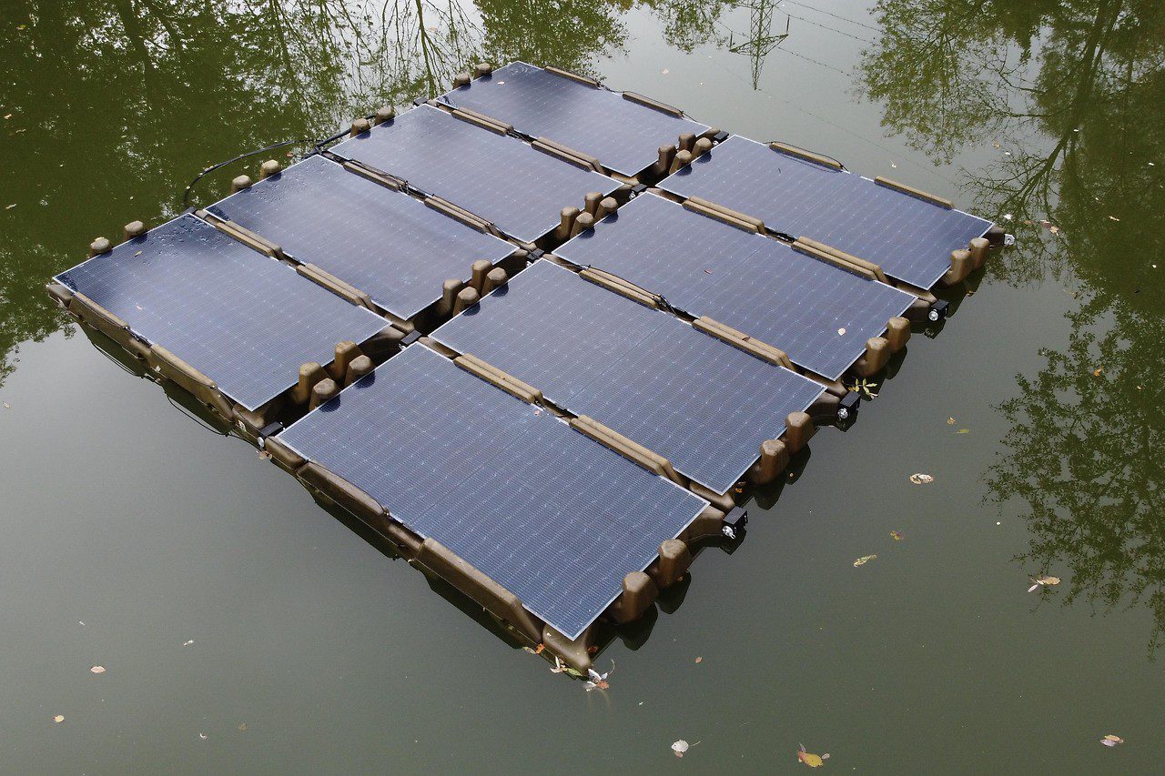 One PV system from Soloan on a gravel pond, eight PV modules on the water