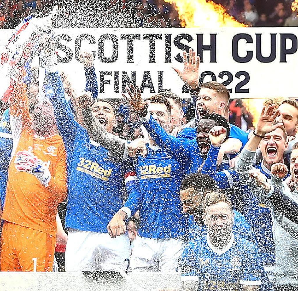 The Glasgow Rangers team celebrates winning the Cup in the final against Hart of Midlothian last May