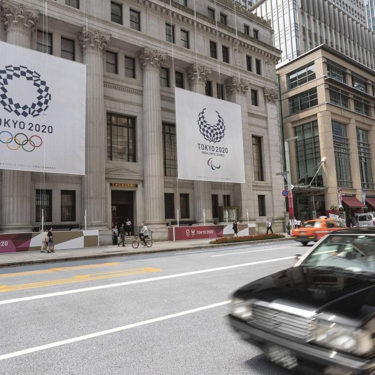 July 25, 2019, Tokyo, Japan - Giant banners of the Tokyo 2020 Olympic Games are displayed outside the Sumitomo Mitsui Trust Bank to promote the 2020 Tokyo Olympic and Paralympic Games.  Tokyo marks a year leading up to the 2020 Olympics with Olympic emblems and photos of Japanese athletes in some buildings in the Nihonbashi district in Tokyo.  The Games are scheduled to open on July 24, 2020.  PublicationsxINxGERxSUIxAUTxHUNxONLY (108582889)  