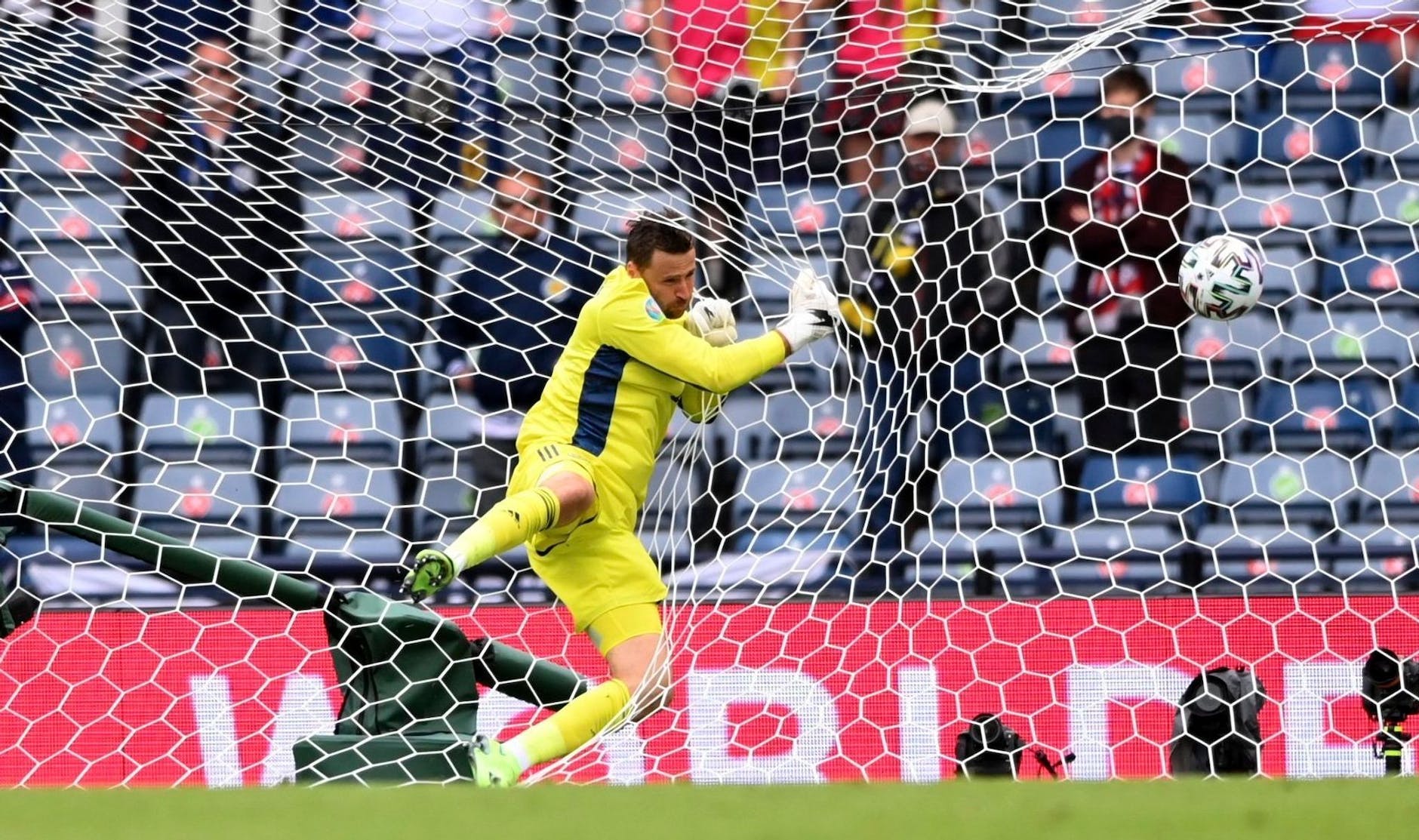Scotland goalkeeper David Marshall took it too late to make it 2–0 and ended up in the net.  